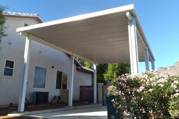 A driveway carport patio structure