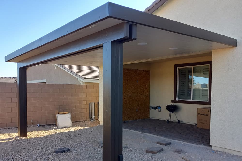 A solid patio cover during the installation process