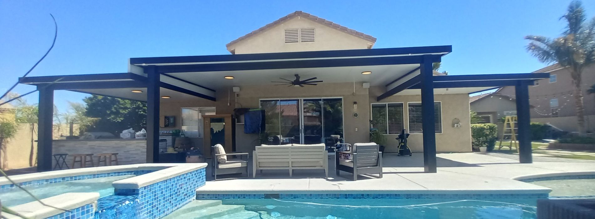 Alumawood Patios & Shade Covers in Las Vegas. Photo of a patio attached to a home, in a backyard with a pool.