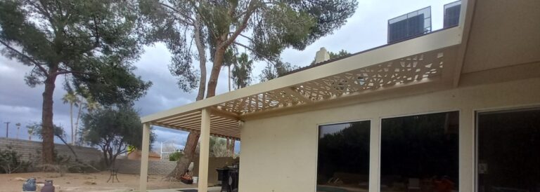 A luxury laser-cut aluminum patio cover that blends in well with the house.