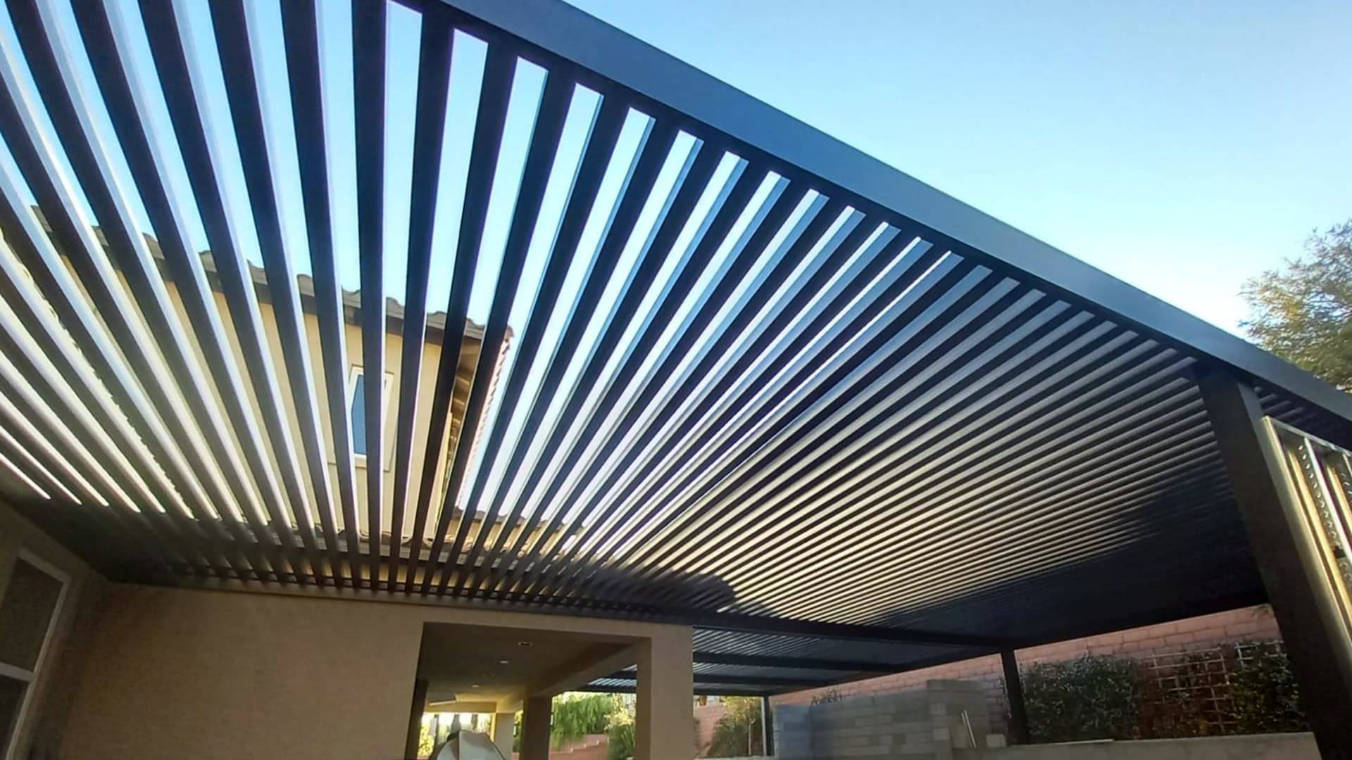 An upward looking view of an open lattice home patio cover